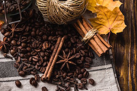 Autumn spices with coffe beans and maple leaves on wooden table. View from above. Stock Photo - Budget Royalty-Free & Subscription, Code: 400-08788049