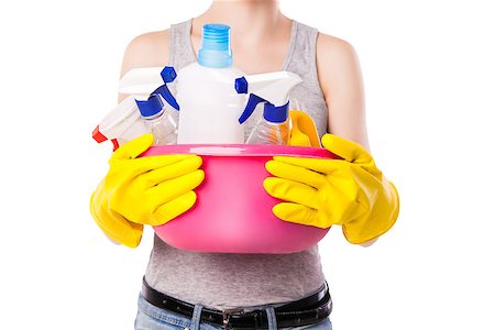 Unknown female holding pink basin with different cleaning substance. Studio photo on white background. Stock Photo - Budget Royalty-Free & Subscription, Code: 400-08788656