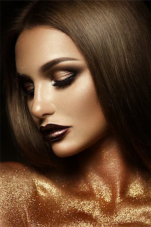 Beautyful girl with gold glitter on her face and body Stock Photo - Budget Royalty-Free & Subscription, Code: 400-08788914