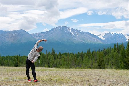 rammellzee (artist) - Male runner stretching outdoors at mountains background. Standing quadriceps quad stretch. Stock Photo - Budget Royalty-Free & Subscription, Code: 400-08794473
