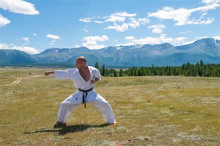 rammellzee (artist) - Man in white kimono and black belt training karate on mountain background. Altay, Russia. Stock Photo - Budget Royalty-Free & Subscription, Code: 400-08795435