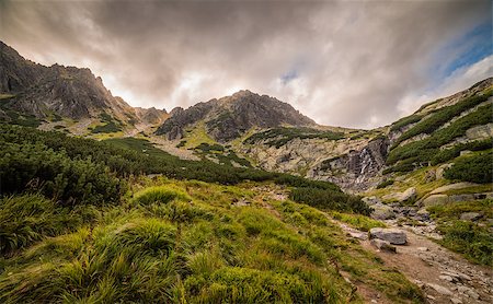 simsearch:400-09275240,k - Mountain Landscape with Skok Waterfall under Dramatic Glowing Sky and Sun Shining From Behind the Peaks. Mlynicka Valley, High Tatra, Slovakia. Photographie de stock - Aubaine LD & Abonnement, Code: 400-08795815