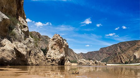 simsearch:400-06749010,k - A low angle view of the river that flows pass Dead Cliff in the Baviaans Kloof World Heritage Site Area in South Africa. Foto de stock - Super Valor sin royalties y Suscripción, Código: 400-08795835