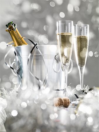 Two champagne glasses, a cooler with cork and silver decoration, stylish tinted Stock Photo - Budget Royalty-Free & Subscription, Code: 400-08795842