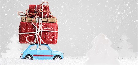 Blue retro toy car delivering Christmas or New Year gifts on gray background Stock Photo - Budget Royalty-Free & Subscription, Code: 400-08795888