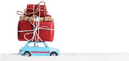 Blue retro toy car delivering Christmas or New Year gifts, isolated on white Stock Photo - Budget Royalty-Free & Subscription, Code: 400-08796571
