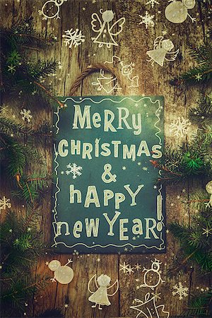 simsearch:400-07614271,k - Christmas greeting card. Xmas wreath card with with  on wooden background. Christmas ornaments on wood. Foto de stock - Super Valor sin royalties y Suscripción, Código: 400-08790419