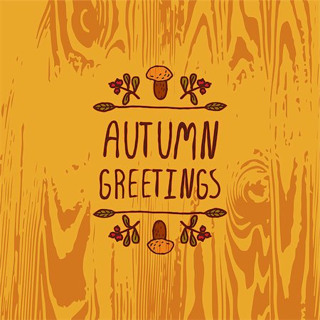 simsearch:400-08793659,k - Hand-sketched typographic element with mushroom, berries and text on wooden background. Autumn greetings Stock Photo - Budget Royalty-Free & Subscription, Code: 400-08790589