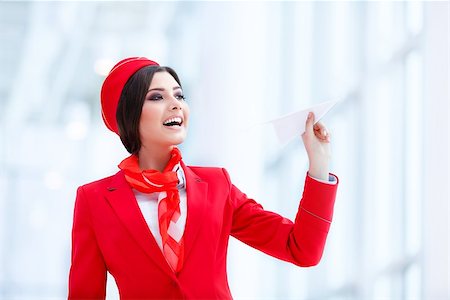 simsearch:400-04429524,k - Young stewardess with plane indoors Stock Photo - Budget Royalty-Free & Subscription, Code: 400-08792671
