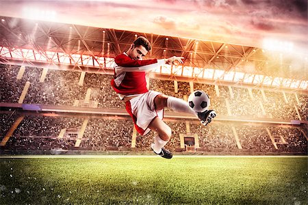 simsearch:400-06513403,k - Football player play in a stadium with audience Stock Photo - Budget Royalty-Free & Subscription, Code: 400-08792787