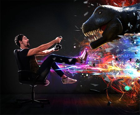 Man with joystick plays with video games of dinosaur Stock Photo - Budget Royalty-Free & Subscription, Code: 400-08792781