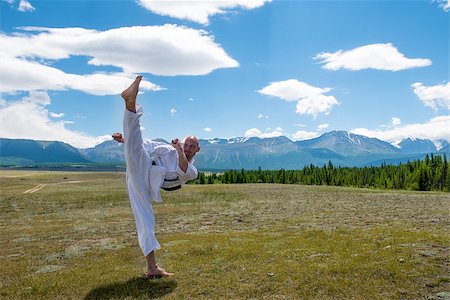 rammellzee (artist) - Man in white kimono and black belt training karate on mountain background. Altay, Russia. Stock Photo - Budget Royalty-Free & Subscription, Code: 400-08793084
