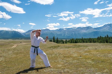 rammellzee (artist) - Man in white kimono and black belt training karate on mountain background. Altay, Russia. Stock Photo - Budget Royalty-Free & Subscription, Code: 400-08793085