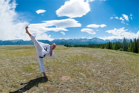 rammellzee (artist) - Man in white kimono and black belt training karate on mountain background. Altay, Russia. Stock Photo - Budget Royalty-Free & Subscription, Code: 400-08793083