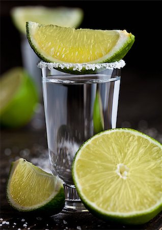 silver lime - Tequila silver shot with lime slices and salt on grunge wooden board Stock Photo - Budget Royalty-Free & Subscription, Code: 400-08793269