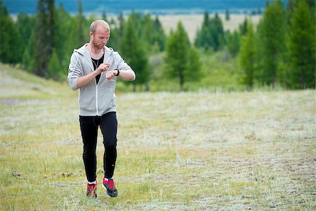 rammellzee (artist) - Man uses a smart watch during the run in the mountains. Altay. Stock Photo - Budget Royalty-Free & Subscription, Code: 400-08793432