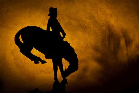 Silhouette of cowboy on a bucking bronco. orange yellow sunset background with shadows of prairie grass. Stock Photo - Budget Royalty-Free & Subscription, Code: 400-08793890