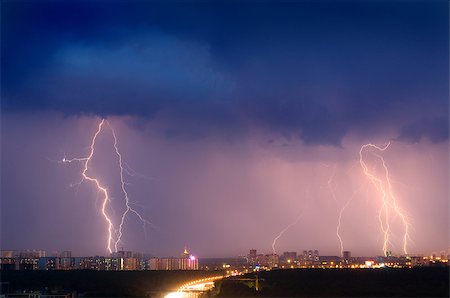 Lightning strike over city in purple light. Stock Photo - Budget Royalty-Free & Subscription, Code: 400-08793939