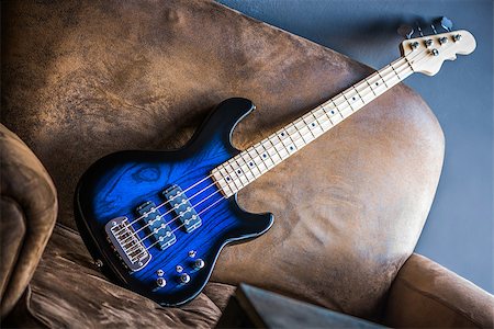 simsearch:400-08572683,k - Bass Guitar Leaning Against a Couch. Blue Bass Guitar. Stock Photo - Budget Royalty-Free & Subscription, Code: 400-08793954