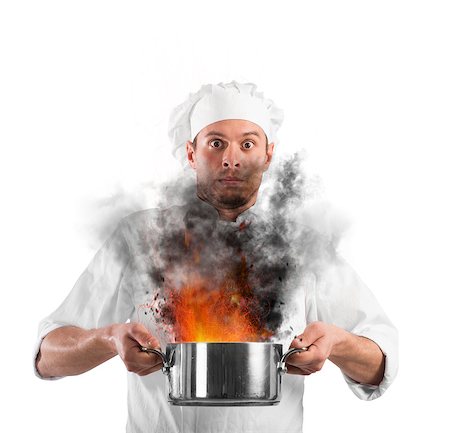 pan to the fire - Chef shocked holding a pot with flames Stock Photo - Budget Royalty-Free & Subscription, Code: 400-08806653