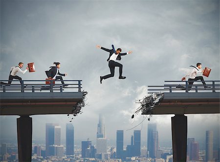 Business people overcome a broken bridge with a big jump Stock Photo - Budget Royalty-Free & Subscription, Code: 400-08806673