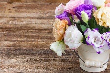 Pink, white and violet eustoma flowers in pot on aged wooden background Stock Photo - Budget Royalty-Free & Subscription, Code: 400-08806879