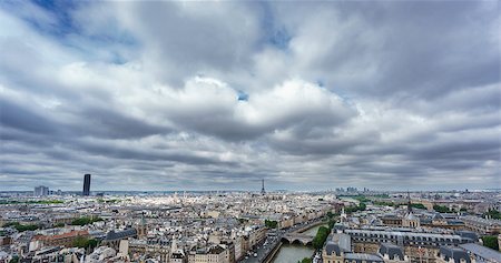 paris rooftops skyline eiffel - Cloudy day with Eiffel and Montparnasse towers over Paris roofs skyline Stock Photo - Budget Royalty-Free & Subscription, Code: 400-08806891