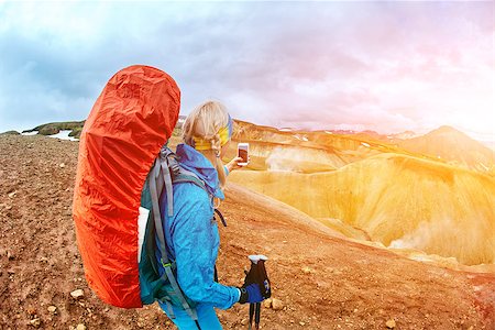 phone mountains view - woman hiker photographer taking selfie on the rhyolite mountains background in Iceland Stock Photo - Budget Royalty-Free & Subscription, Code: 400-08806975