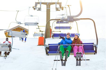 Smiling couple in sportswear on a lift Stock Photo - Budget Royalty-Free & Subscription, Code: 400-08808051