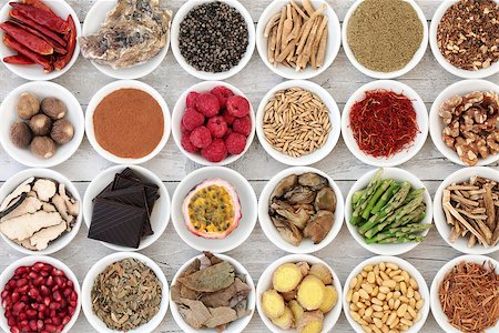 Aphrodisiac food for good sexual health with foods in china bowls over distressed wooden background. Photographie de stock - Aubaine LD & Abonnement, Code: 400-08808644