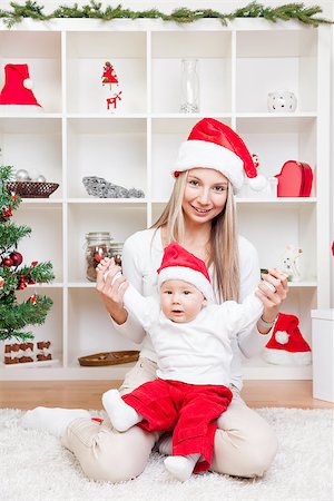simsearch:400-09222788,k - Mother with her beautiful baby boy celebrating Christmas Photographie de stock - Aubaine LD & Abonnement, Code: 400-08809003