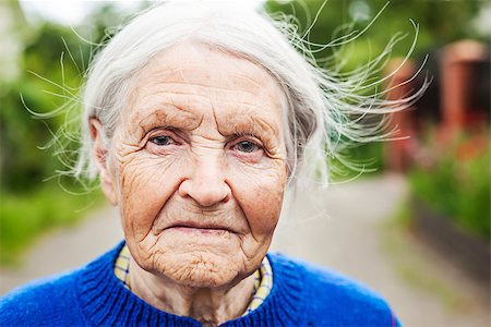 Portrait of an aged woman smiling outdoors Stock Photo - Budget Royalty-Free & Subscription, Code: 400-08809021