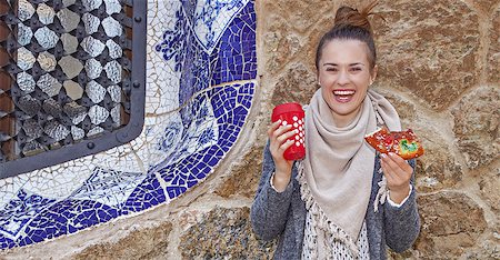epiphany cake - Winter wonderland in Barcelona at Christmas. Full length portrait of smiling elegant tourist woman with a cup of hot beverage and a piece of traditional king cake at Guell Park in Barcelona, Spain Stock Photo - Budget Royalty-Free & Subscription, Code: 400-08809158