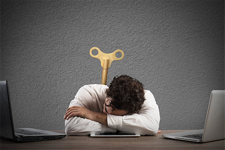 discharge - Businessman exhausted from overwork sleeping over a tablet Stock Photo - Budget Royalty-Free & Subscription, Code: 400-08809195