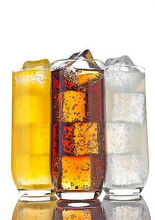 simsearch:400-03911442,k - Glasses with cola orange soda and lemonade with ice cubes and reflection on white background Stockbilder - Microstock & Abonnement, Bildnummer: 400-08809570