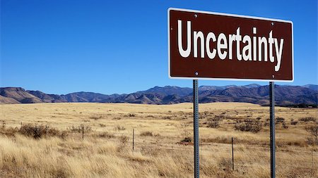 simsearch:400-07333411,k - Uncertainty road sign with blue sky and wilderness Stock Photo - Budget Royalty-Free & Subscription, Code: 400-08809892