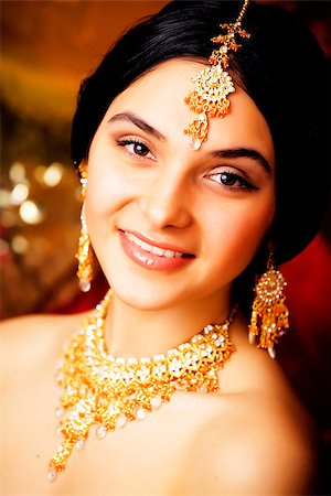 dress for indian dance - beauty sweet real indian girl in sari smiling on black background, jewelry shining Stock Photo - Budget Royalty-Free & Subscription, Code: 400-08809928