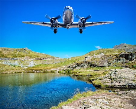 simsearch:400-08864596,k - airplane flying over a lake in the mountains Stock Photo - Budget Royalty-Free & Subscription, Code: 400-08815772