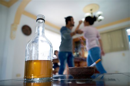 Social issues, abuse and violence on women, young drunk man hitting and beating girl at home after drinking alcohol. Angry husband fighting with abused wife Stock Photo - Budget Royalty-Free & Subscription, Code: 400-08815865