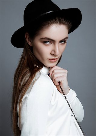 simsearch:400-07316542,k - Beautiful fashion model in white with black hat in studio Stock Photo - Budget Royalty-Free & Subscription, Code: 400-08817292
