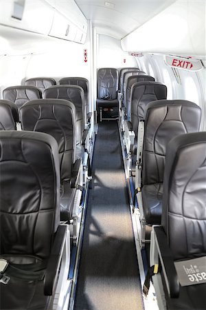 evrenkalinbacak (artist) - Seats in Aircraft cabin of an Jet Airplane Stockbilder - Microstock & Abonnement, Bildnummer: 400-08817472