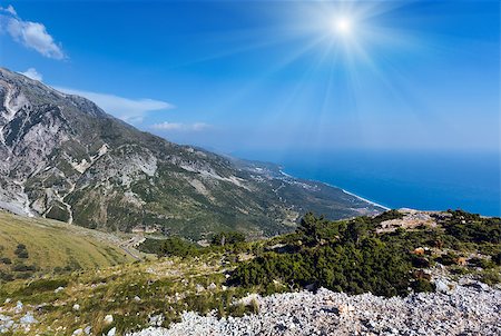 simsearch:400-08817566,k - Summer  Llogara pass sunshiny view  with road, herd of goats on slope and sea water surface (Albania) Photographie de stock - Aubaine LD & Abonnement, Code: 400-08817565