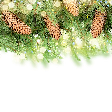 simsearch:400-06391837,k - Fresh pine branch with cones and bokeh llights border over white background Stock Photo - Budget Royalty-Free & Subscription, Code: 400-08811414