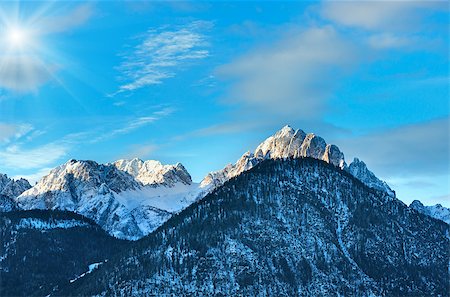 simsearch:400-08817566,k - Winter morning  sunshiny mountain landscape with forest on slope (Austria). Photographie de stock - Aubaine LD & Abonnement, Code: 400-08811471