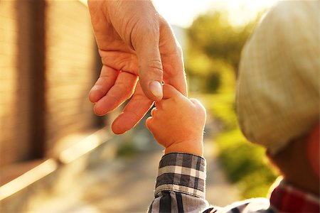 the parent holds the hand of a small child Stock Photo - Budget Royalty-Free & Subscription, Code: 400-08812515