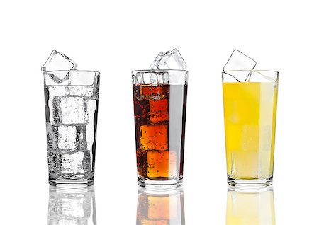 full restaurant - Glasses of cola orange soda lemonade with ice on white background with reflection Stock Photo - Budget Royalty-Free & Subscription, Code: 400-08813115