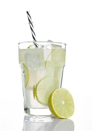 simsearch:400-08814206,k - Glass of healthy lemon lemonade juice with ice on white background Photographie de stock - Aubaine LD & Abonnement, Code: 400-08813131
