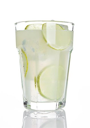 simsearch:400-08814206,k - Glass of healthy lemon lemonade juice with ice on white background Photographie de stock - Aubaine LD & Abonnement, Code: 400-08813132