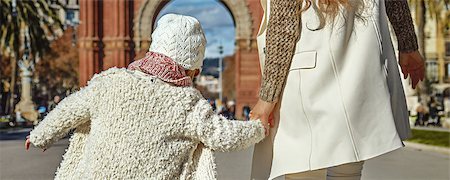 in Barcelona for a perfect winter. Seen from behind modern mother and daughter in Barcelona, Spain walking Stock Photo - Budget Royalty-Free & Subscription, Code: 400-08813562
