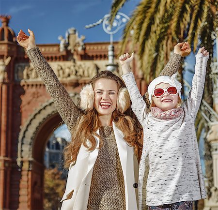 simsearch:400-08864986,k - in Barcelona for a perfect winter. Portrait of happy trendy mother and child near Arc de Triomf in Barcelona, Spain rejoicing Stock Photo - Budget Royalty-Free & Subscription, Code: 400-08813570